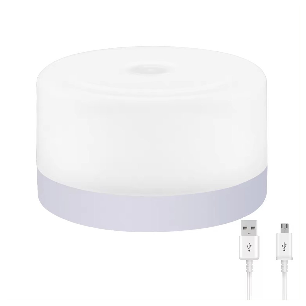 White battery-operated night light with USB charging port and cables.